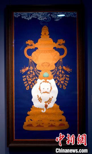 圖為5月16日，展覽中的新創(chuàng)唐卡作品《瑞象承香》?！±盍?攝